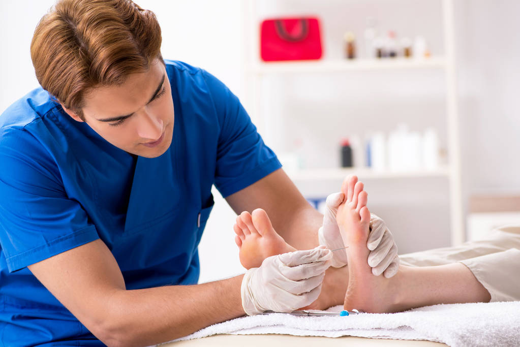 Podiatrist treating feet in Oakleigh